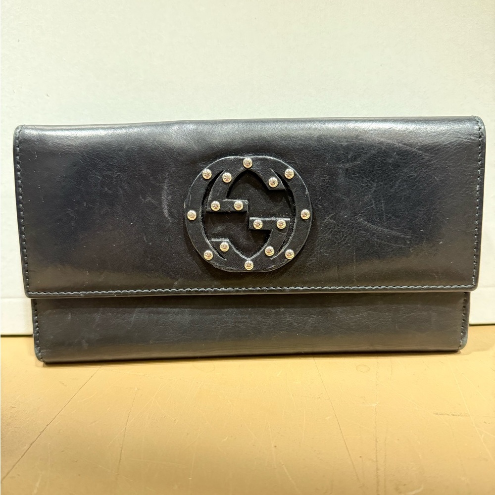 Gucci Black Leather Clutch with Gold Accents